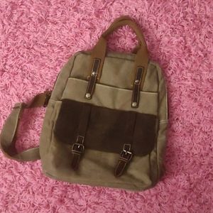 Canvas backpack real leather detail.